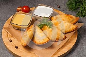 Posekunchiki - small pies with meat, with mustard dressing and sour cream