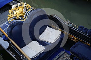 Posh blue Venetian gondola Venice Italy photo