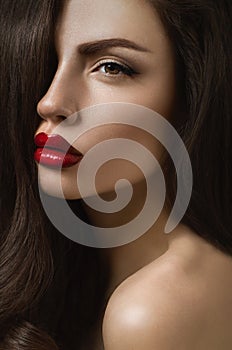 Posh brunette woman with red lips