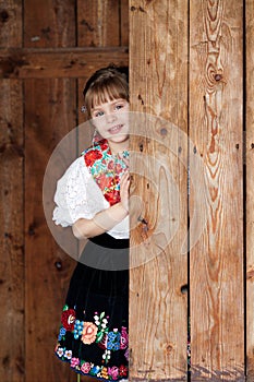 Posing baby girl in traditional costume