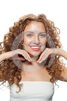 Posing young healthy lady portrait. Perfect woman with long frizzy hairstyle, natural makeup and fresh skin isolated