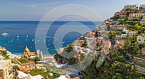 Positano houses and church with sea in background