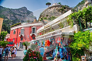 Positano, Italy - June 29, 2021: Tourists along the city colorful streets in summer season