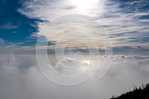 Positano - Scenic view from Monte Comune on thick clouds covering the coastal town Positano at the Amalfi Coast, Campania, Italy.