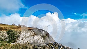 Positano - Scenic view from Monte Comune on thick clouds covering the coastal town Positano at the Amalfi Coast, Campania, Italy.