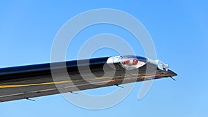 Position light on the wing of the plane, Red navigation light on left wing of jet airplane