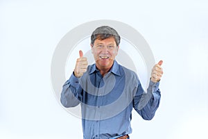 Positiv looking man showing thumbs up sign