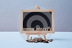 Positive Attitude, Happy and optimistic thinking Concept. The inscription think positive on the blackboard. Mockup