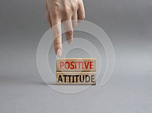 Positive attitude symbol. Concept words Positive attitude on wooden blocks. Beautiful gr...kground..... Businessman hand. Business