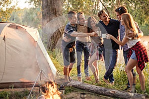 Positive awesome youth having picnic in amazing nature