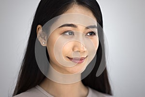 Positive beautiful young Asian woman close up casual portrait