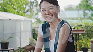 Positive beautiful young woman gardener smiling laughing looking to camera