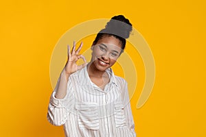 Positive Black Girl Showing Ok Gesture And Sincerely Smiling