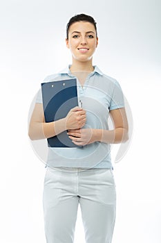 Positive brunette doctor in white wearing with diary