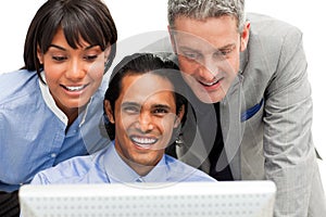 Positive business group working at a computer