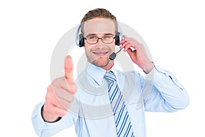 Positive businessman with headset end thumb up