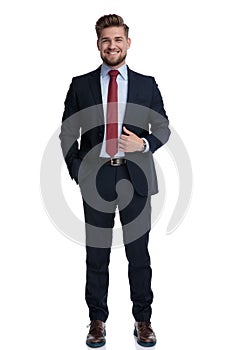 Positive businessman man laughing and adjusting his jacket