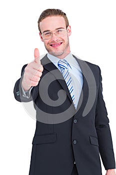 Positive businessman smiling with thumb up