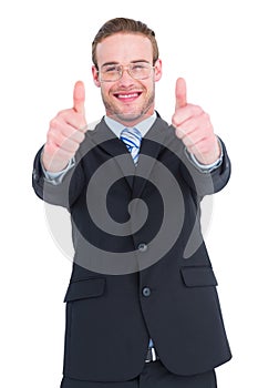 Positive businessman smiling with thumbs up