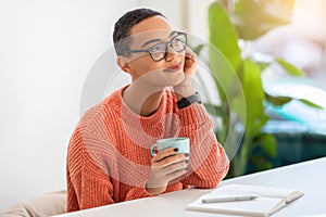 Positive calm young latin woman in glasses enjoy peace and free time, planning day