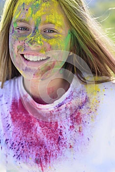 Positive and cheerful. colorful neon paint makeup. Crazy hipster girl. Summer weather. child with creative body art