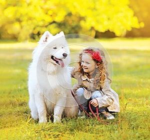 Positive child and dog having fun outdoors