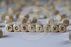 Positive - cube with letters, sign with wooden cubes