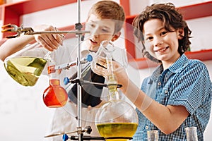 Positive curious boys visiting a scientific club