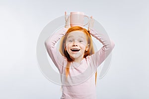 Positive delighted child posing on camera