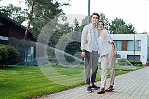 Positive delighted couple enjoying their walk together