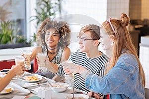 Positive delighted friends spending their break together