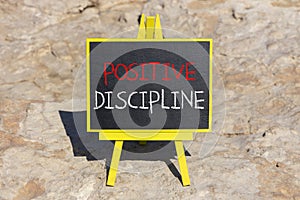 Positive discipline symbol. Concept words Positive discipline on beautiful black chalk blackboard. Chalkboard. Beautiful stone