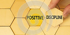 Positive discipline symbol. Concept words Positive discipline on beautiful wooden puzzles. Beautiful yellow paper background.