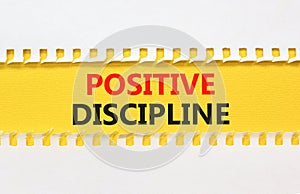 Positive discipline symbol. Concept words Positive discipline on beautiful yellow paper. Beautiful white table white background.