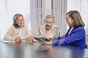 positive emotion senior couple consulting with insurance agent
