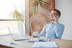 Positive emotions. Business concept. Cheerful professional adult caucasian finance manager in glasses and blue shirt