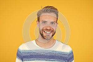 Positive emotions. Happy man on yellow background. Bearded man smiling. Man with mustache and beard happy face