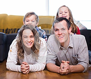 Positive family enjoying evening together at home