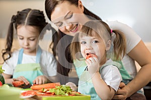 Positive family preparing lunch in the kitchen