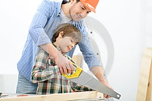 Positive father and son doing renovation