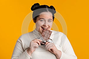 Positive Fatty Girl Biting Chocolate Bar, Enjoying Eating Sweets