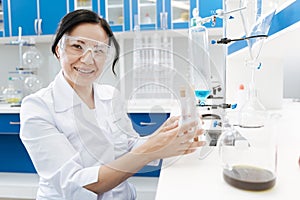 Positive female chemist enjoying her job