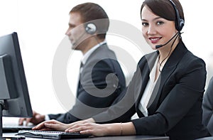 Female Customer Services Agent With Headset Working In A Call Center