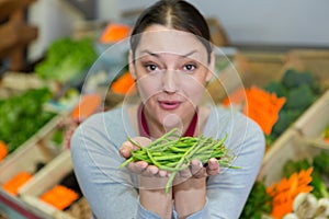 positive female selling green beans