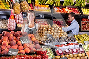 Positive female and man laying out vegetables photo