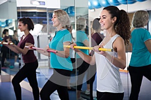 Positive females different ages having gymnastic class