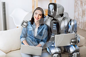 Positive girl and robot bonding to each other