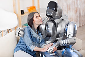 Positive girl and robot bonding to each other