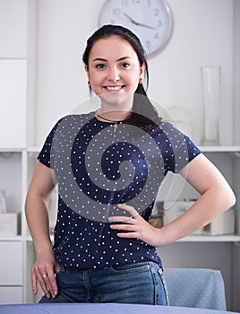 Positive girl standing at room
