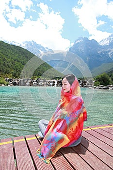 Positive happy life, careless Asian Chinese woman enjoy free time by a lake